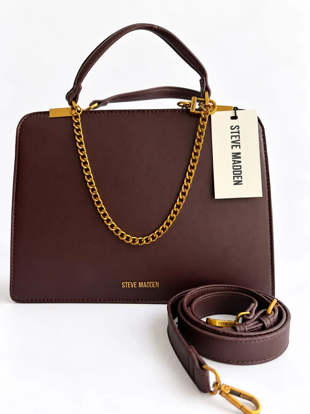 Bolsa Steve Madden color tinto con cadena dorada